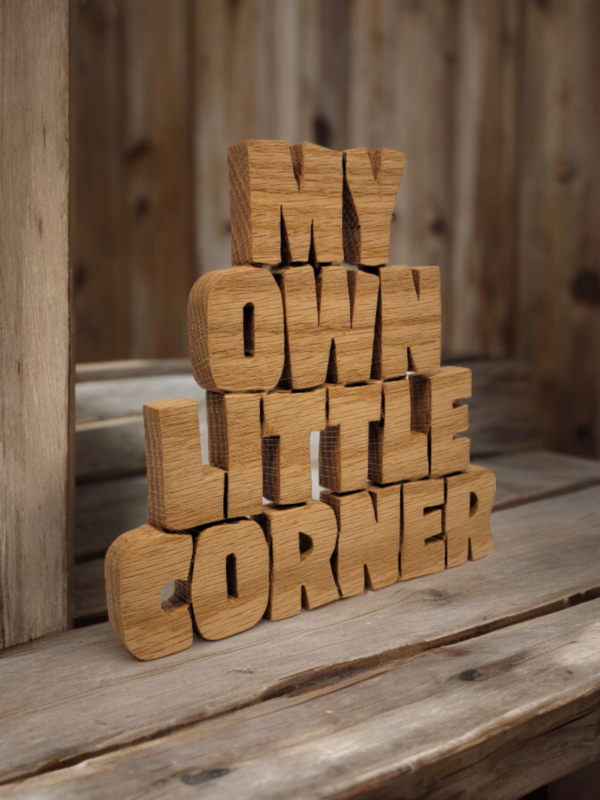 Wood plaque cut from a single piece of wood that reads "My Own Little Corner".