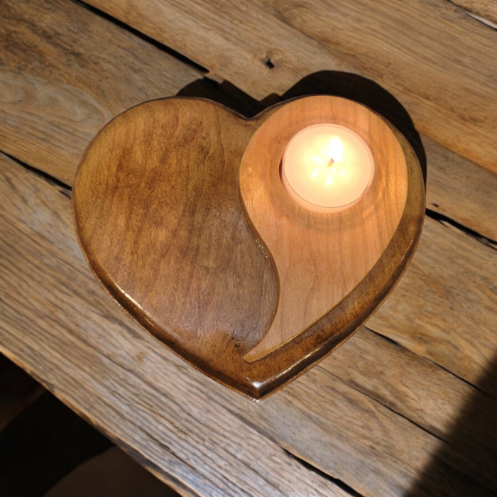 Natural wood tealight holder, in the shape of a heart with the yin yang symbol on top.