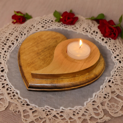 Natural wood tealight holder, in the shape of a heart with the yin yang symbol on top.