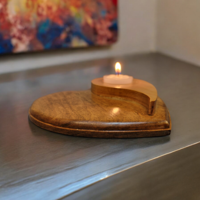 Natural wood tealight holder, in the shape of a heart with the yin yang symbol on top.