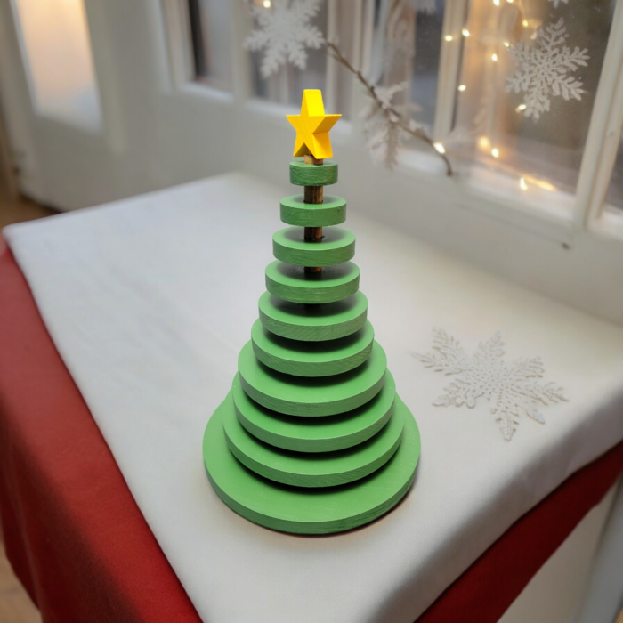 Ornamental wood christmas tree made from wood discs, decreasing in size up to the top. A yellow star adorns the tree.