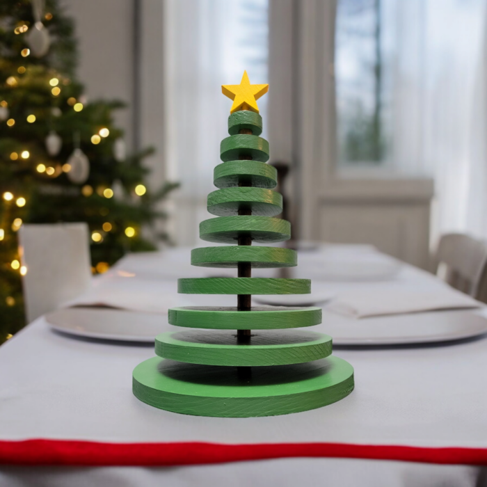 Ornamental wood christmas tree made from wood discs, decreasing in size up to the top. A yellow star adorns the tree.