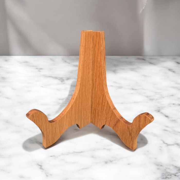 Oak plate stand sitting on a marble counter.