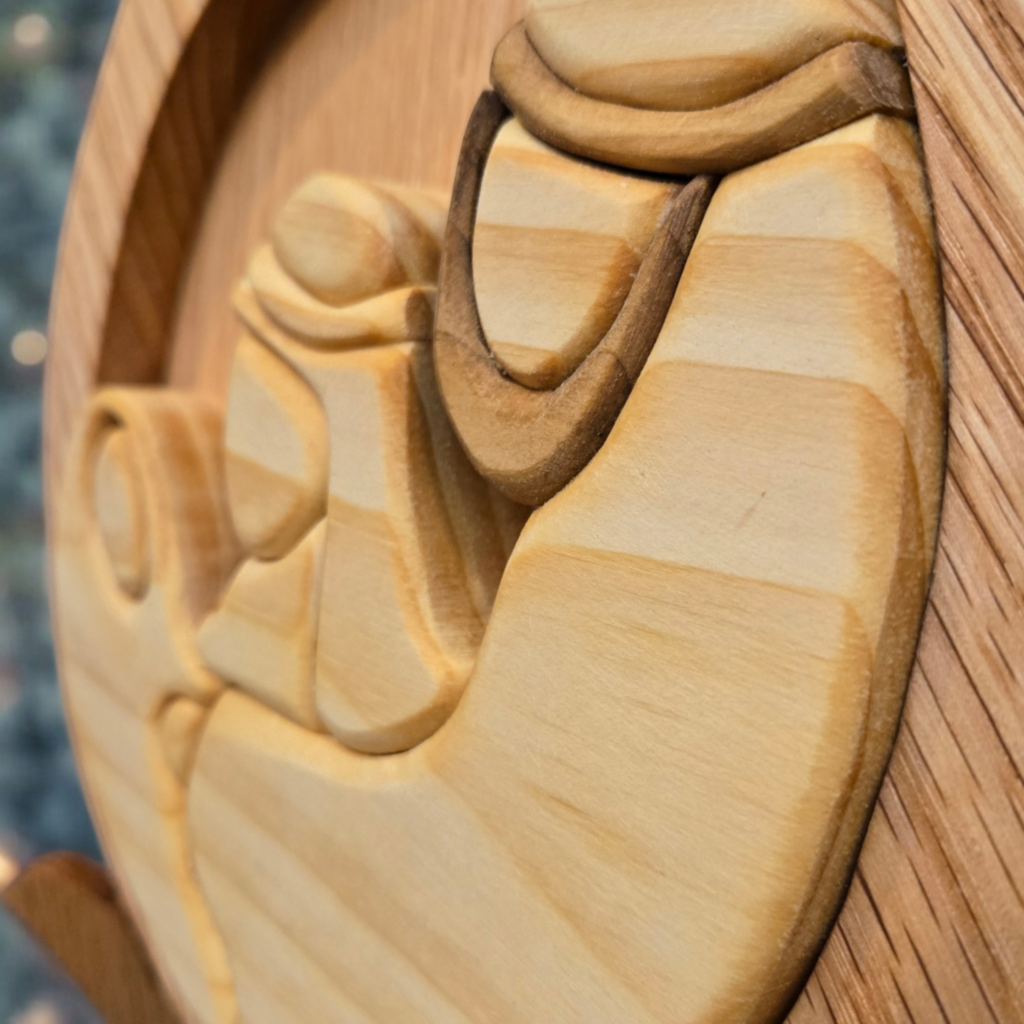 Close up photo of a wooden nativity scene, having just been finished with oil.